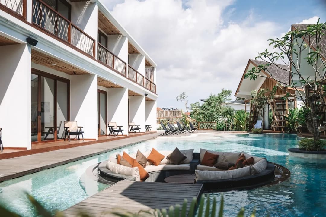 Illustrative hotel swimming pool with sun loungers