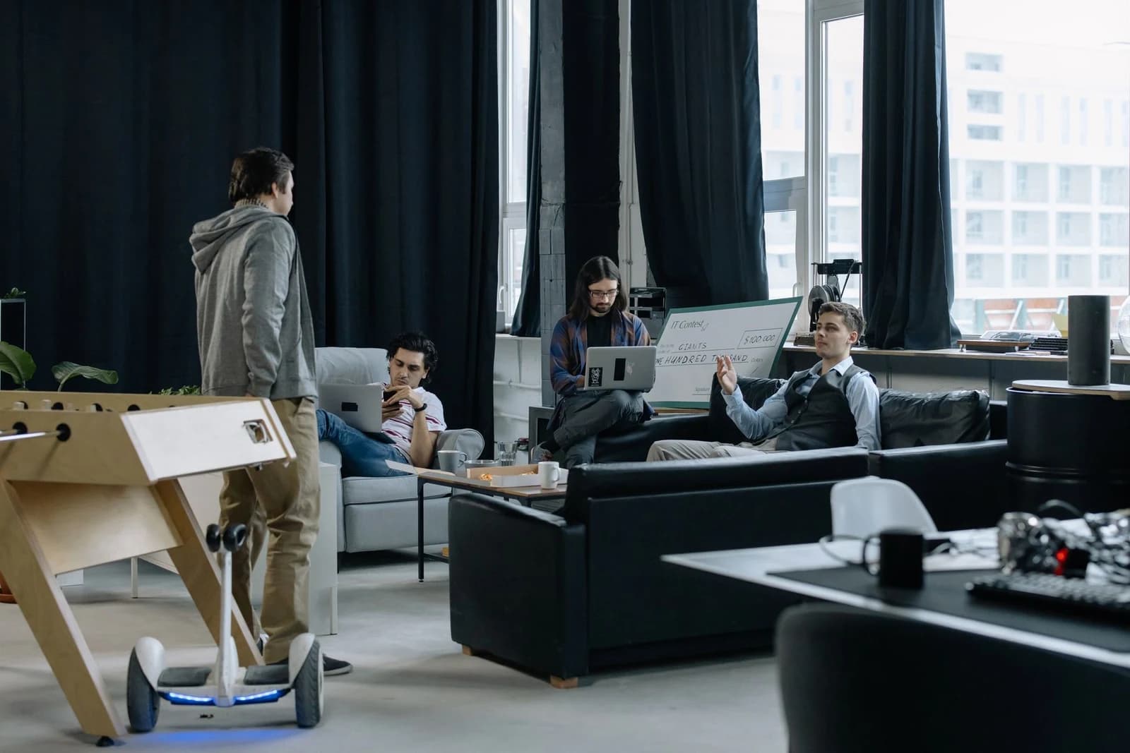 Colleagues discussing work in a contemporary office